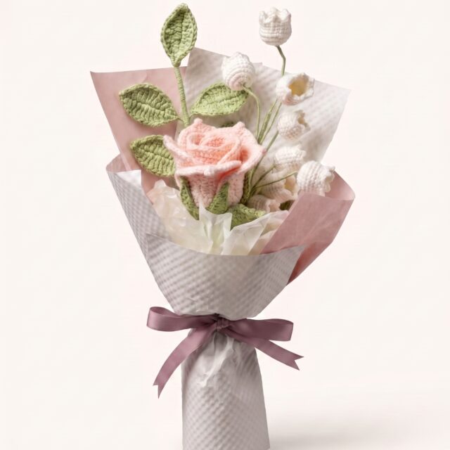 Handmade blush pink crochet rose and lily-of-the-valley bouquet, front view