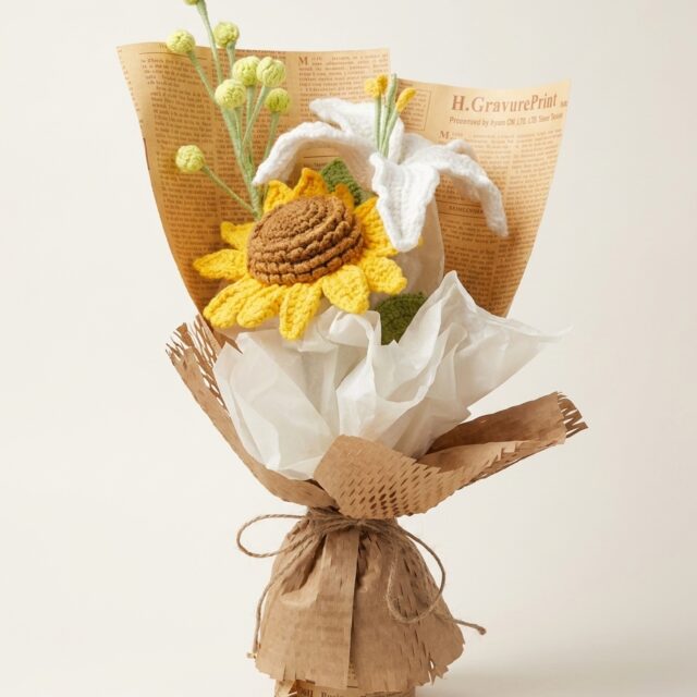 Handmade yellow crochet sunflower and white lily bouquet, front view